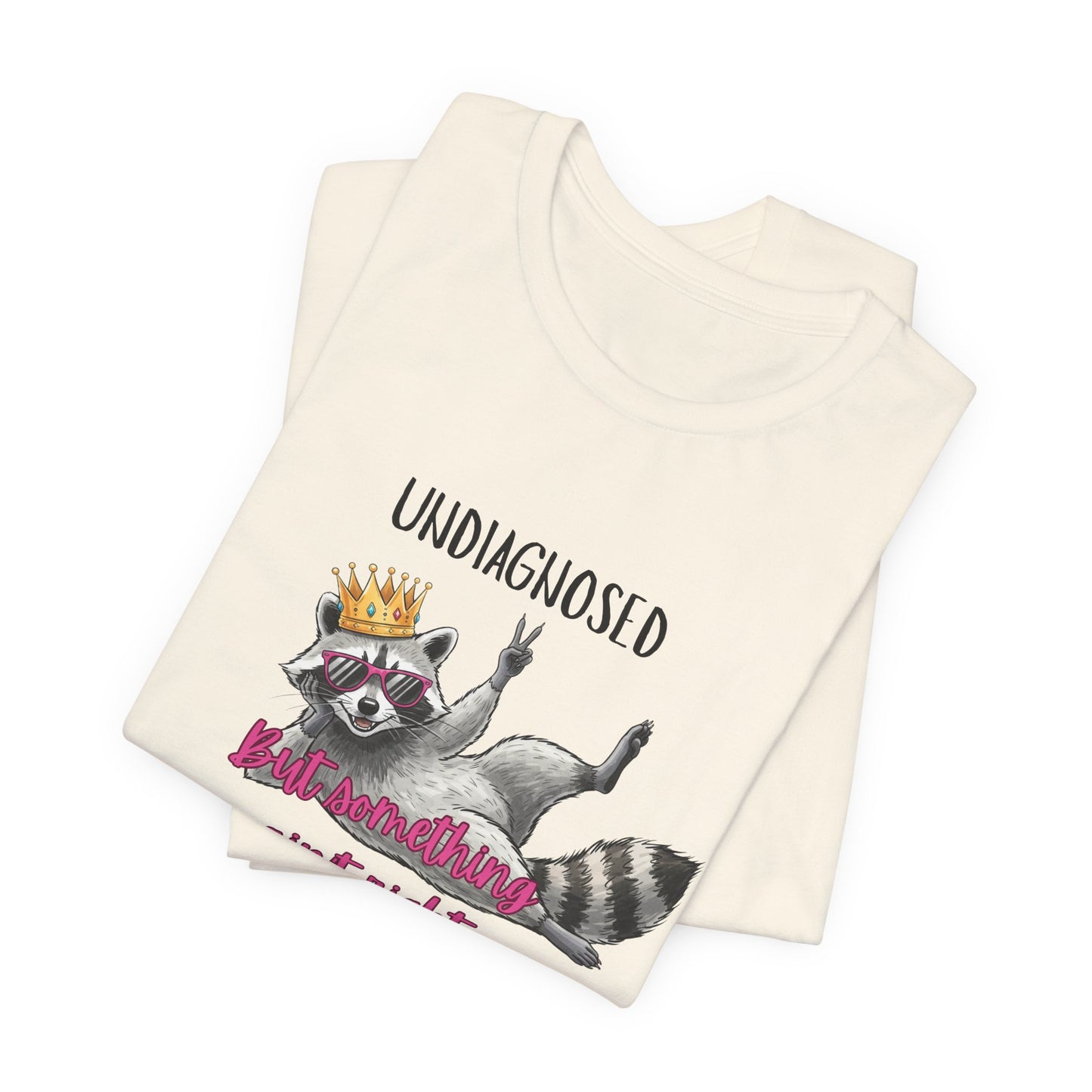 Funny Raccoon Graphic Tee – “Undiagnosed But Something Ain’t Right” T-Shirt, Quirky Meme Shirt, Casual Humor Tee, Trendy Streetwear Top